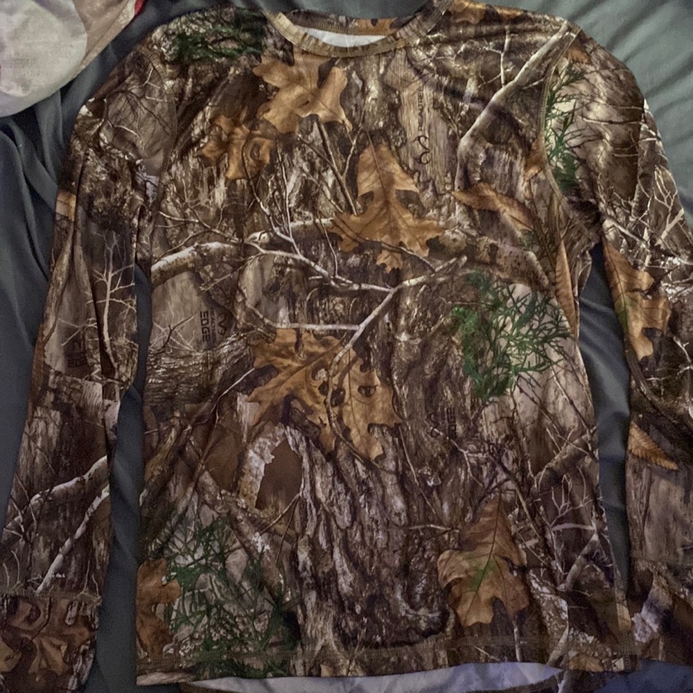 I’m selling a man’s real tree hunting shirt.